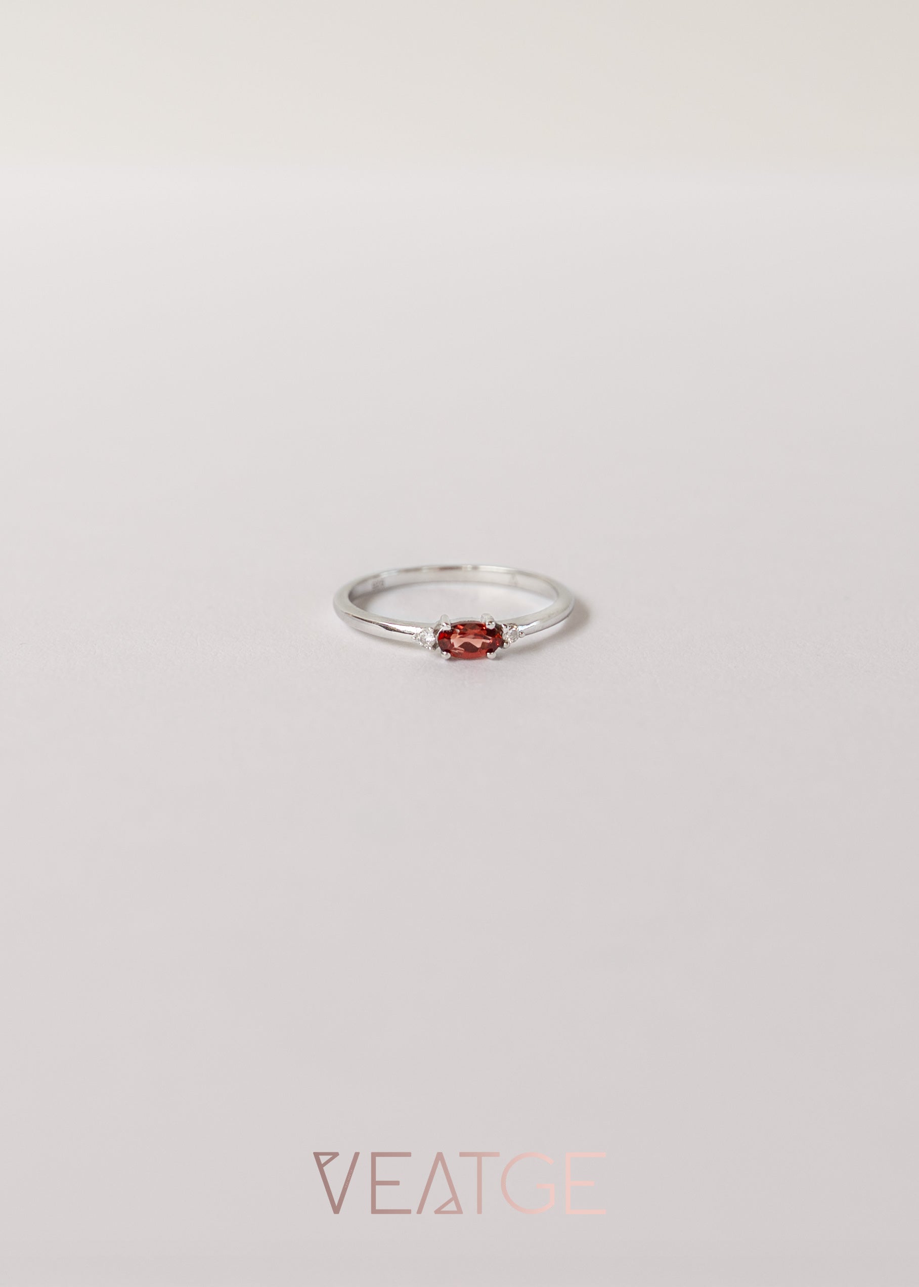 Silver birthstone stacking ring with a real garnet gemstone