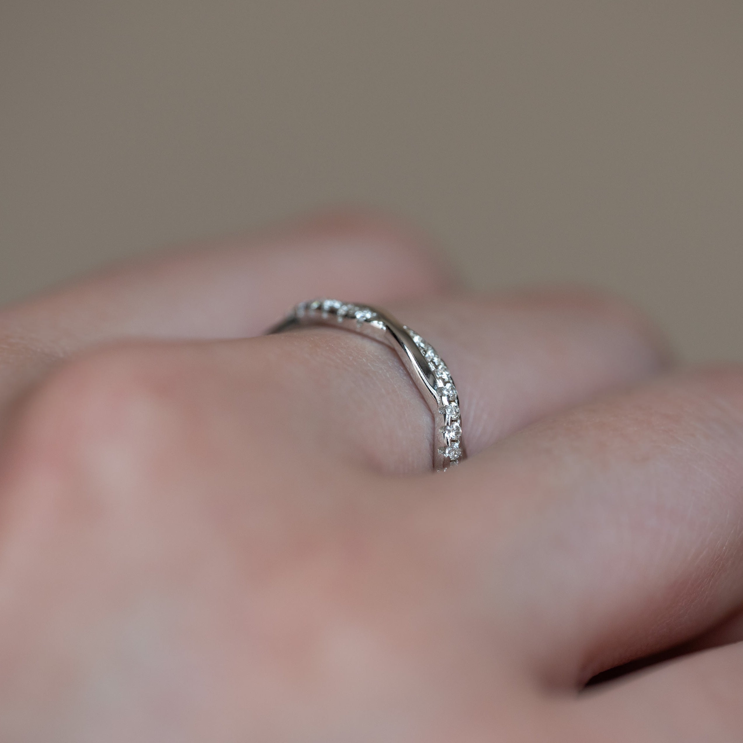 Moissanite Wedding Band Twist Design in sterling silver with diamonds