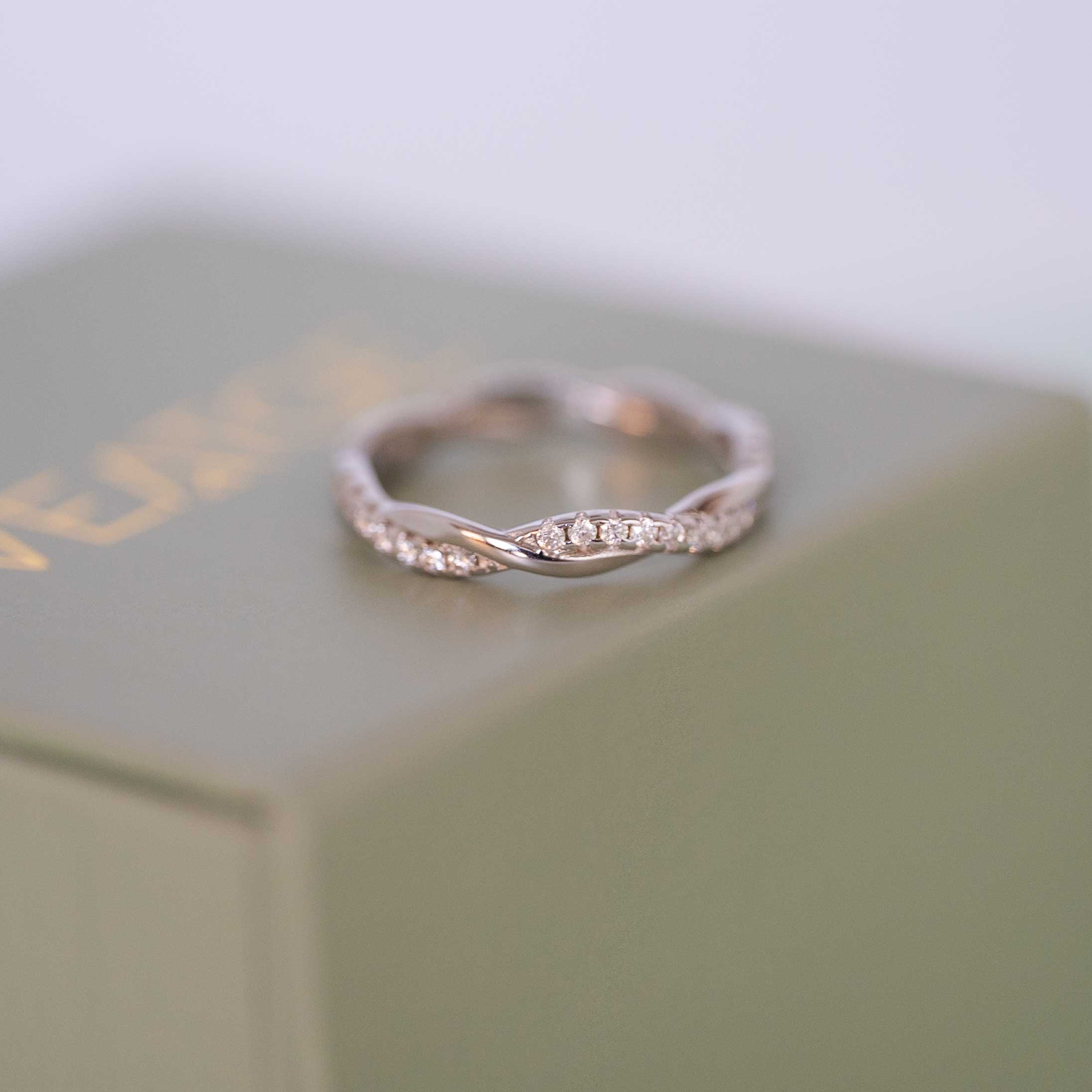 Moissanite Wedding Band Twist Design in sterling silver with diamonds