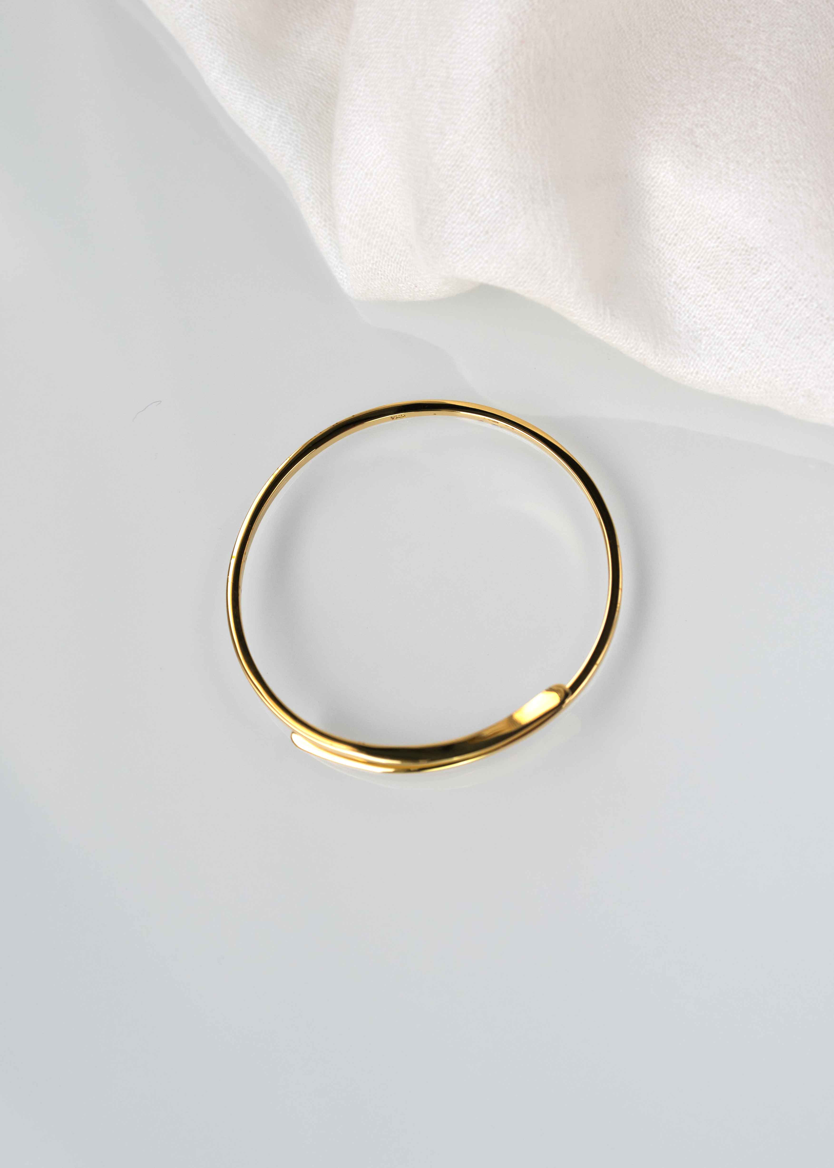 crossover gold bangle