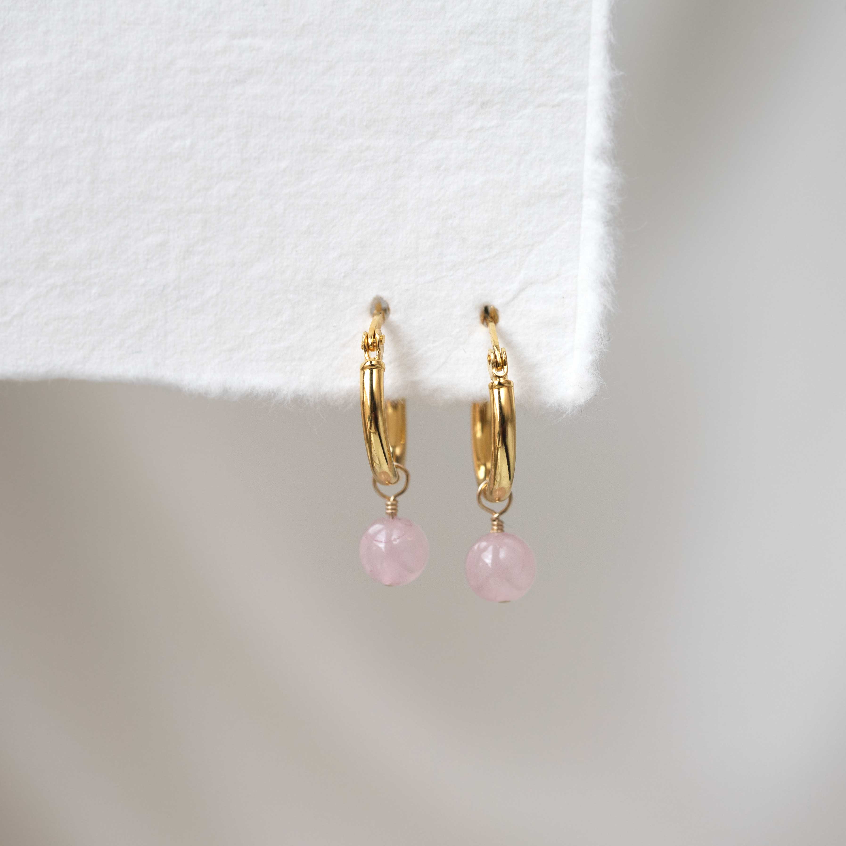 rose quartz earrings in gold hoops