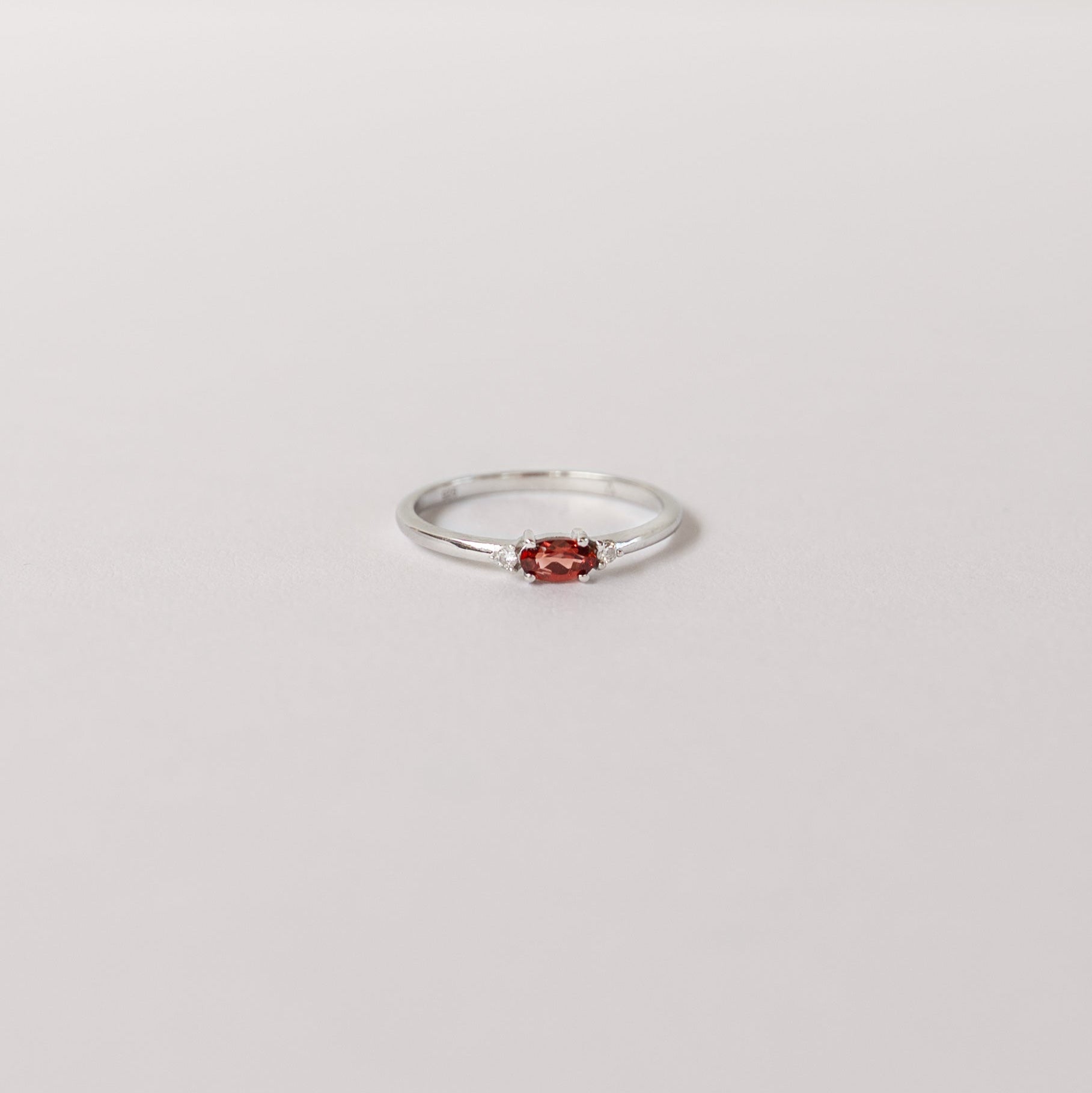 Silver birthstone stacking ring with a real garnet gemstone