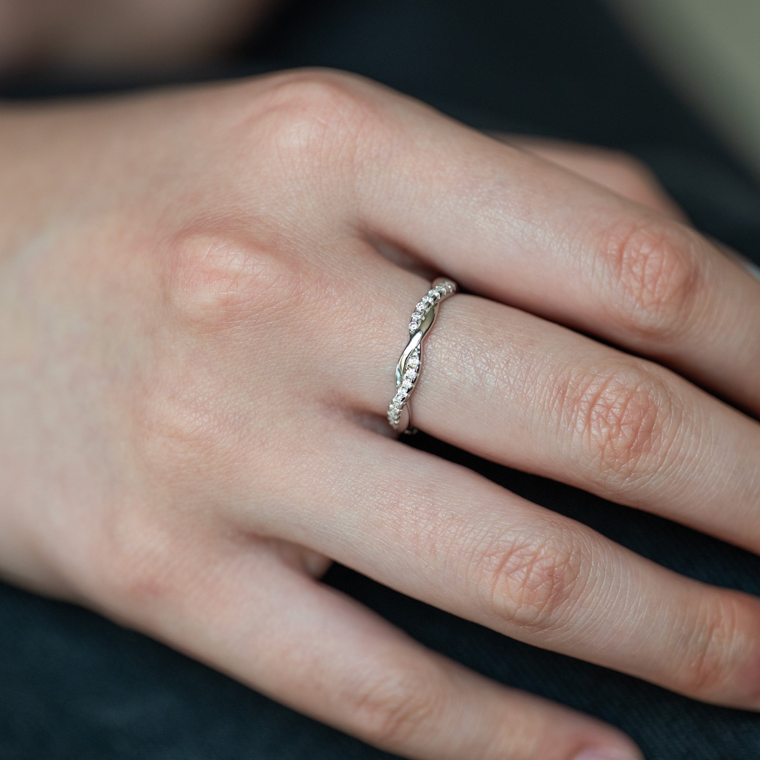Moissanite Wedding Band Twist Design in sterling silver with diamonds