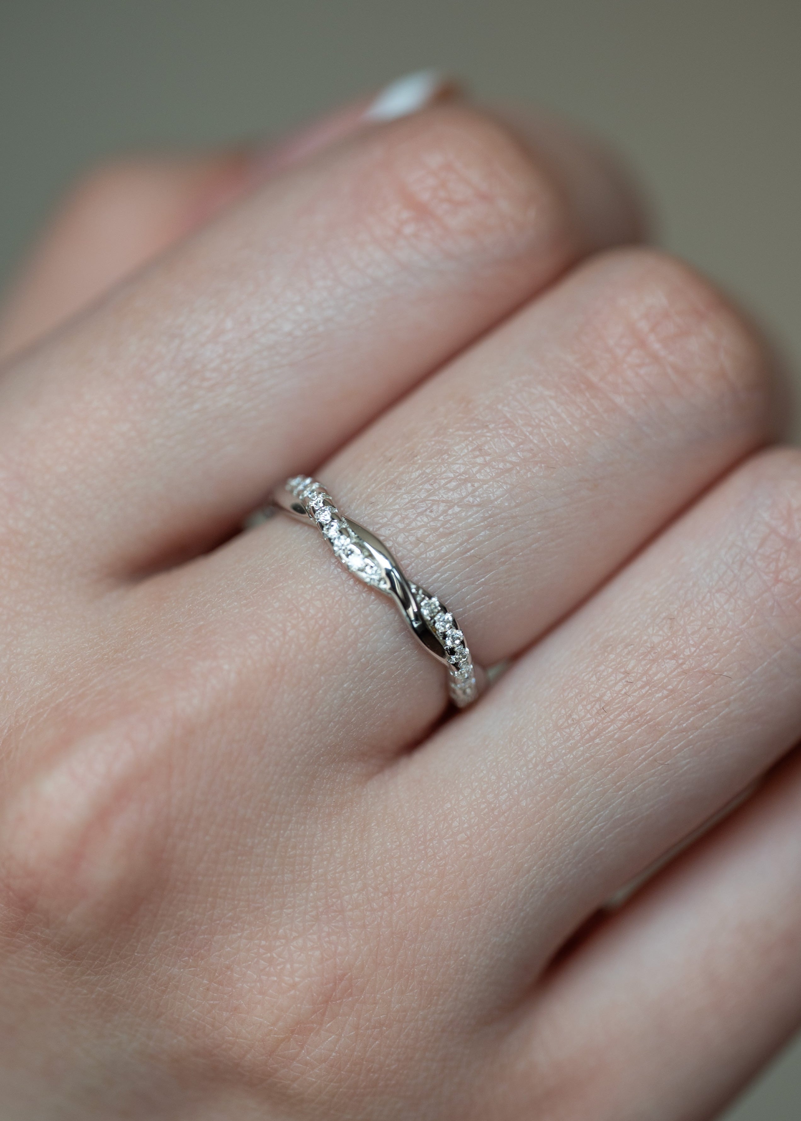 Moissanite Wedding Band Twist Design in sterling silver with diamonds