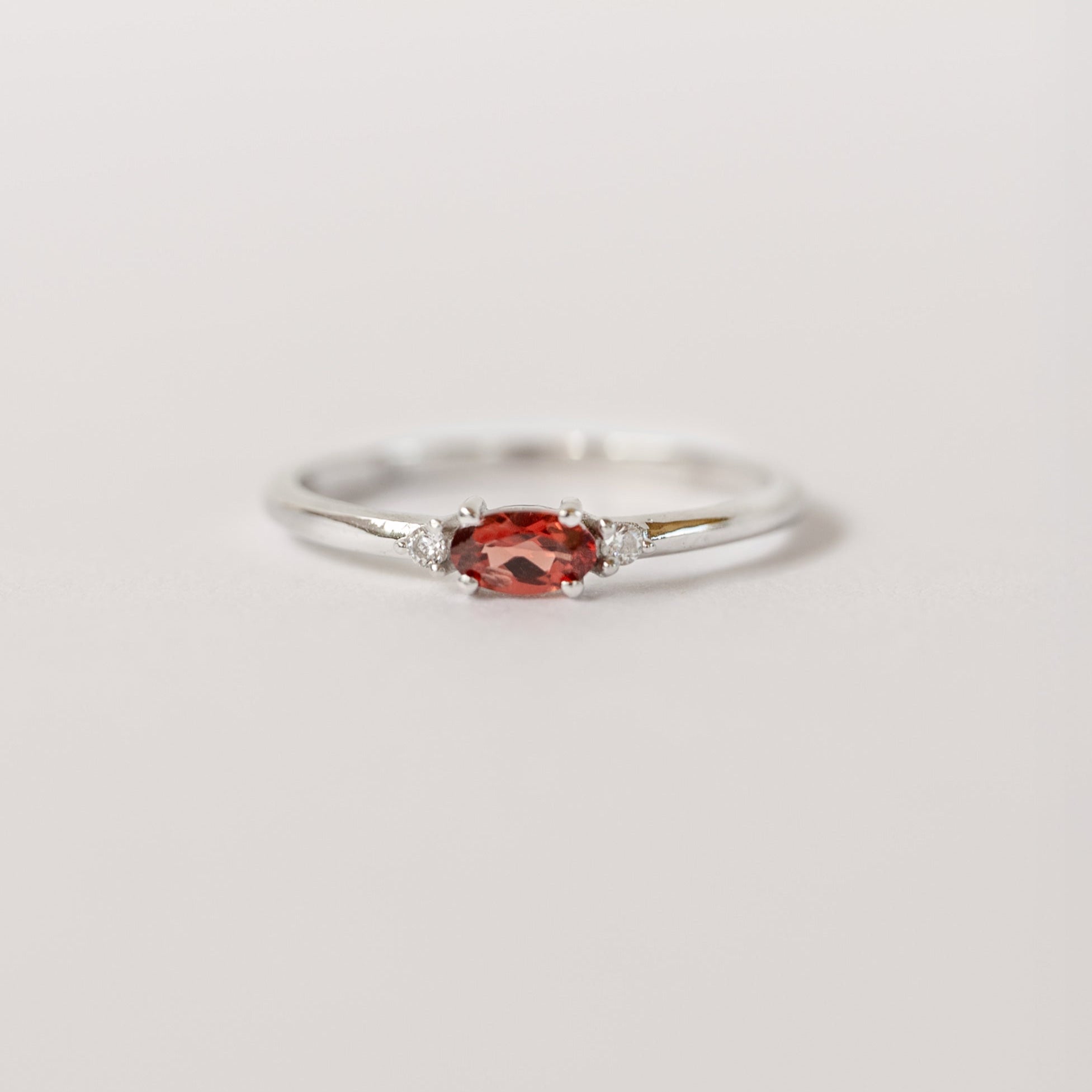 Silver birthstone stacking ring with a real garnet gemstone