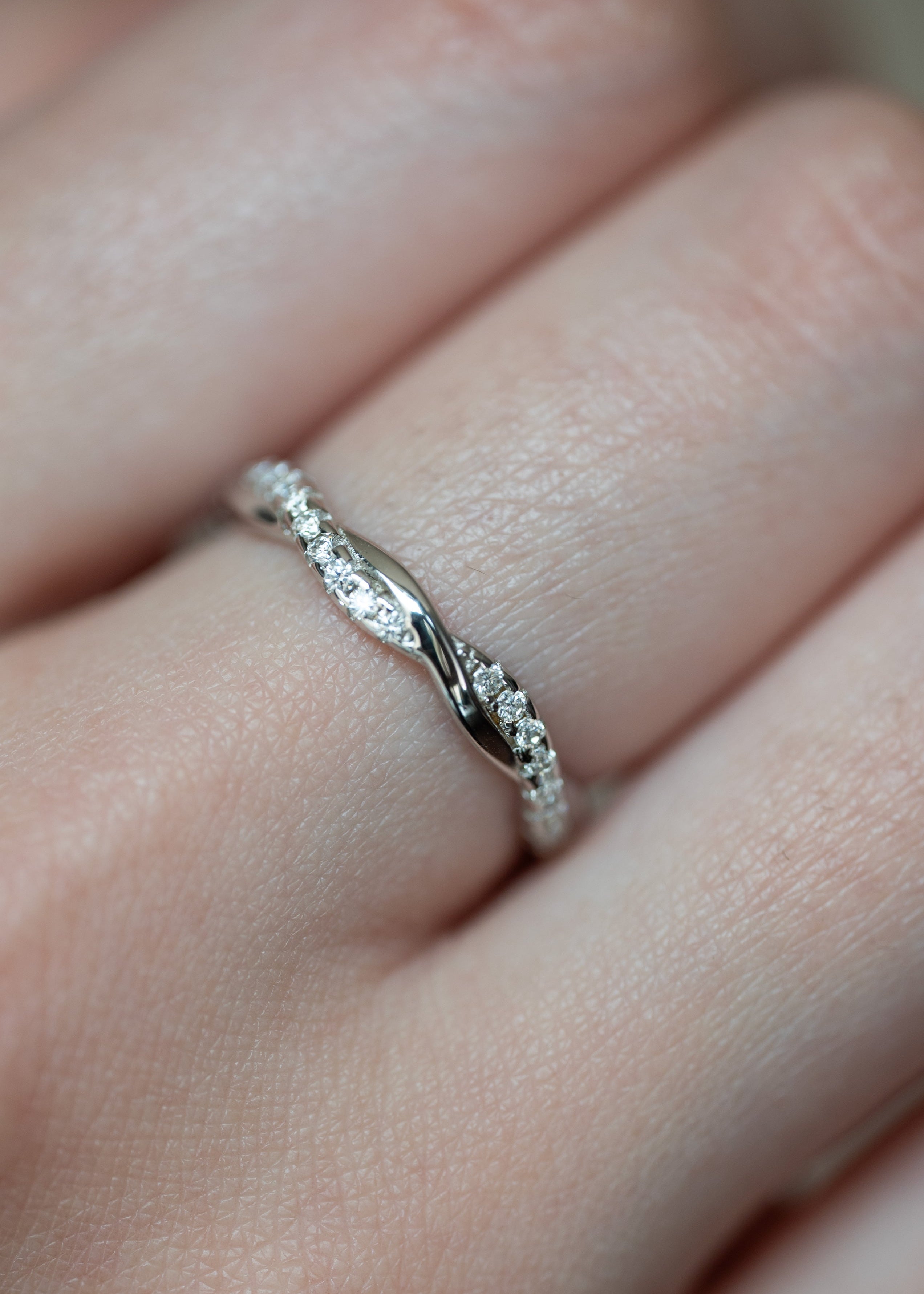 Moissanite Wedding Band Twist Design in sterling silver with diamonds