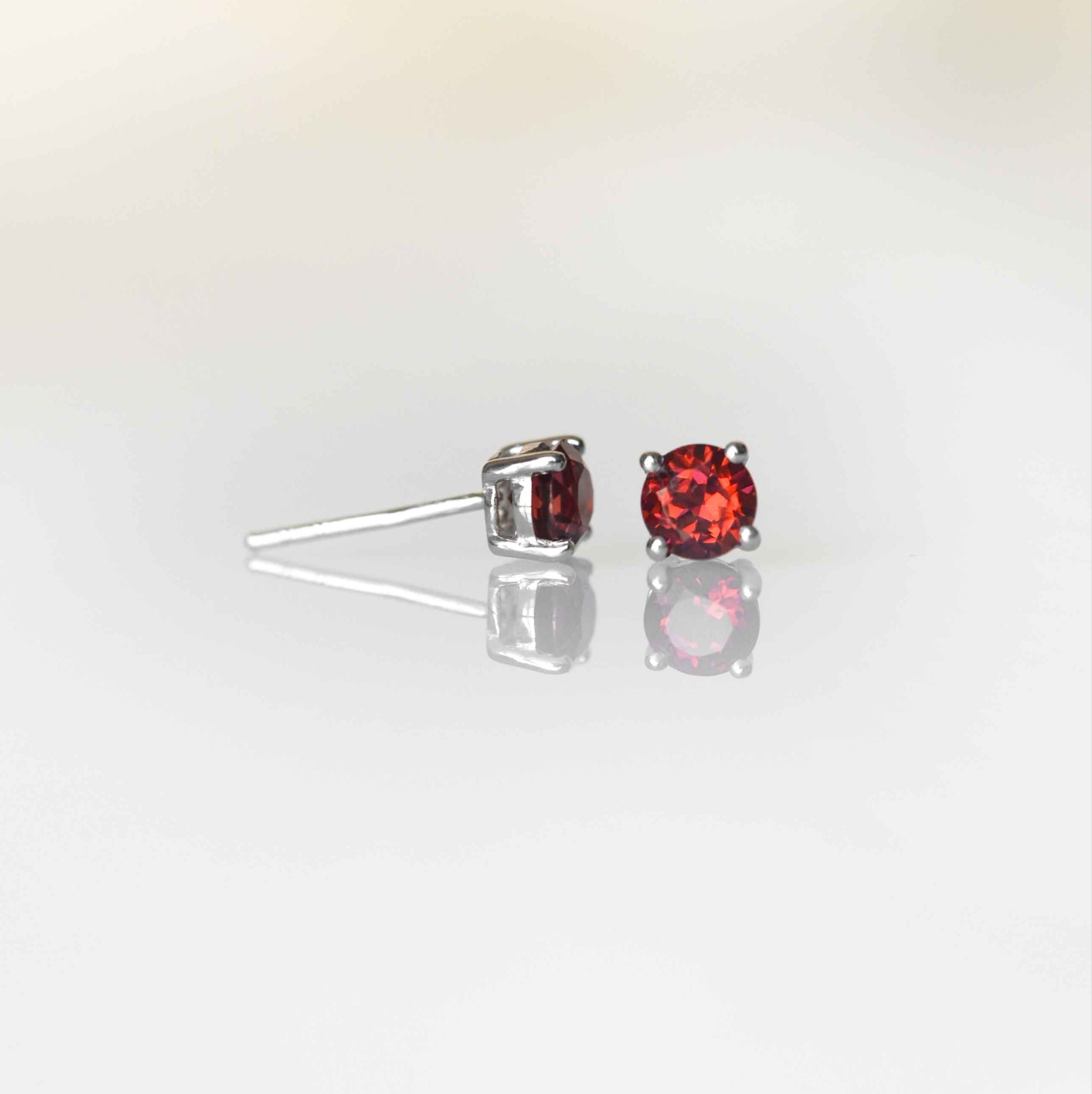 garnet studs earrings in sterling silver